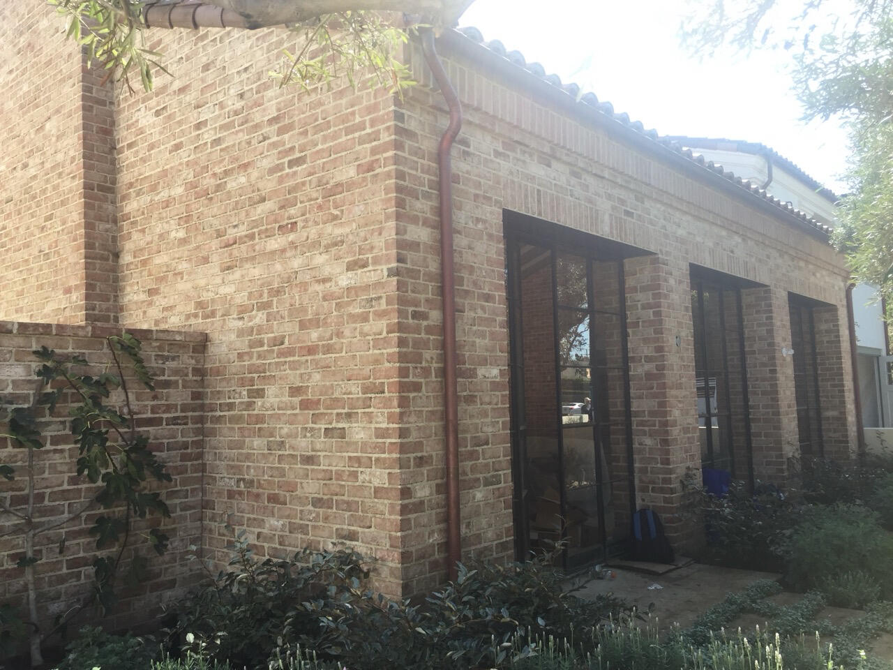 Beautiful herringbone patterned brick inside a fireplace.